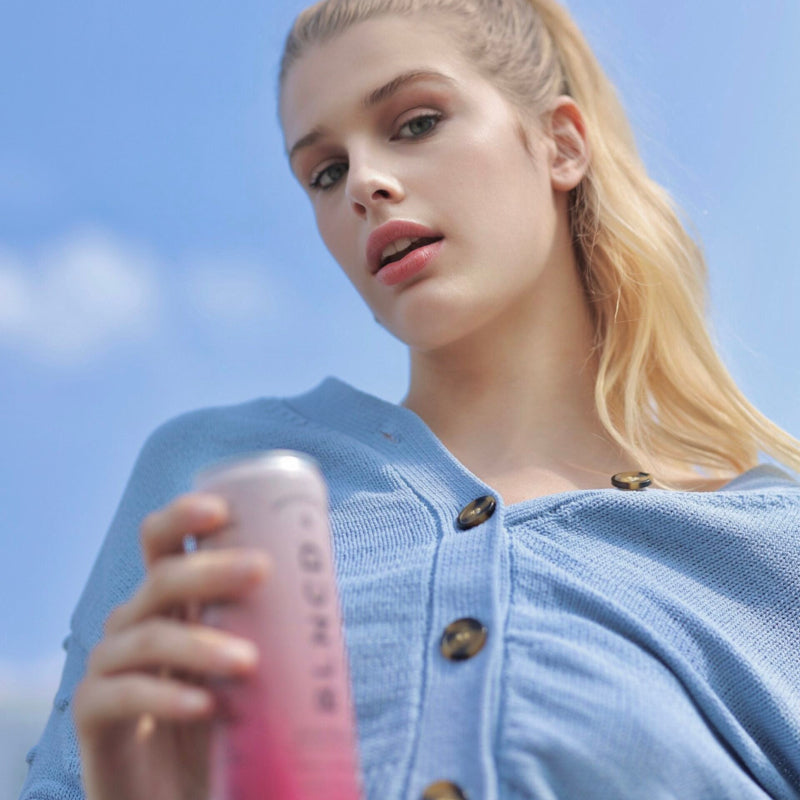 BLNCD Brain Boost Cannabis Beverage Girl holding can at Sèchey