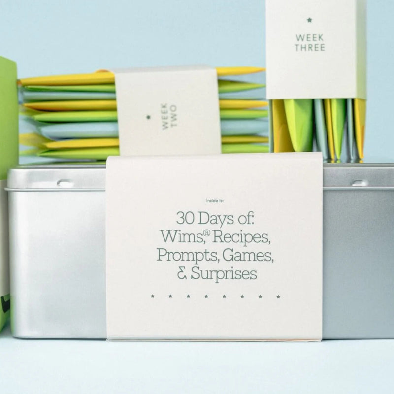 Product packaging with colorful cards and a central white card displaying text on a light blue background