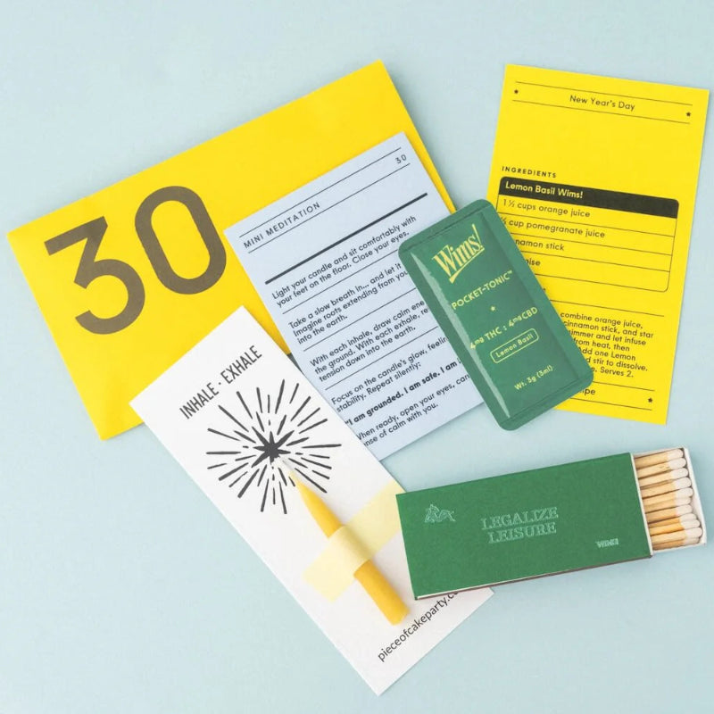 Collection of items including a yellow book with '30' on a light blue background